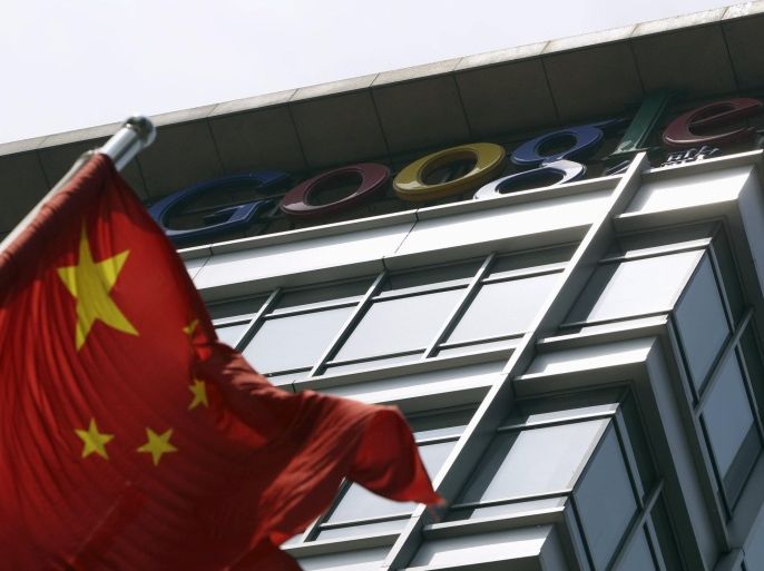 A Chinese national flag waves in front of the former headquarters of Google China in Beijing in this June 2, 2011 file photo. Google Inc expects to return to mainland China as early as this fall following a five-year absence, tech website The Information reported on September 4, 2015. REUTERS/Jason Lee/Files