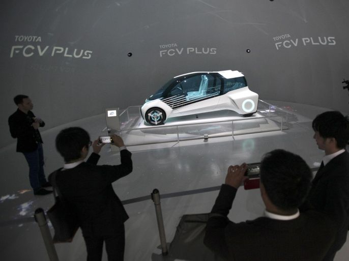 In this Oct. 29, 2015 photo, Toyota Motor Corp.'s FCV PLUS concept is displayed in the media preview of the Tokyo Motor Show in Tokyo. Toyota Motor Corp. reported Thursday, Nov. 5, 2015 a 13.5 percent increase in quarterly profit due to strong sales, cost cuts and a favorable exchange rate. (AP Photo/Shuji Kajiyama)