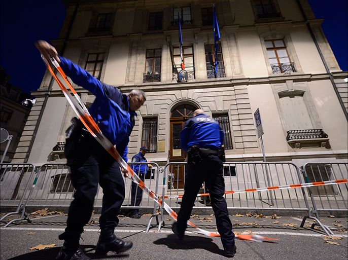 epa05025494 Geneva police officers install fences in front of the French Consulate in Geneva, Switzerland, 14 November 2015. At least 120 people have been killed in a series of attacks in Paris on 13 November, according to French officials. Eight assailants were killed, seven when they detonated their explosive belts, and one when he was shot by officers, police said. EPA/LAURENT GILLIERON