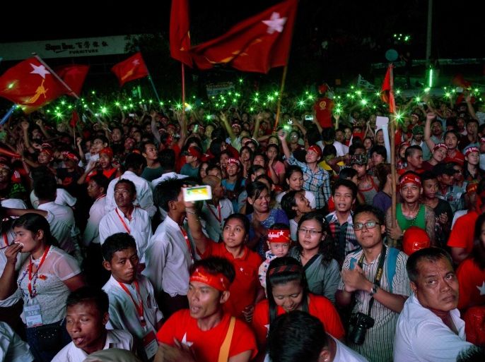 Supporter of Myanmar's National League for Democracy party flash their mobile phones as they gather to celebrate unofficial election results outside the NLD headquarters in Yangon, Myanmar, Monday, Nov. 9, 2015. Opposition leader Aung San Suu Kyi's NLD party said Monday that it was confident it was headed for a landslide victory in Myanmar's historic elections, and official results from the government that began trickling in appeared to back up the claim. (AP Photo/Gemunu Amarasinghe)