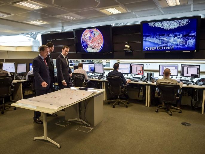 Britain's Chancellor of the Exchequer George Osborne is shown the 24 hour Operations Room inside GCHQ, by the Director of GCHQ Robert Hannigan (C) and Cheltenham MP Alex Chalk (L), in Cheltenham November 17, 2015. REUTERS/Ben Birchall/Pool