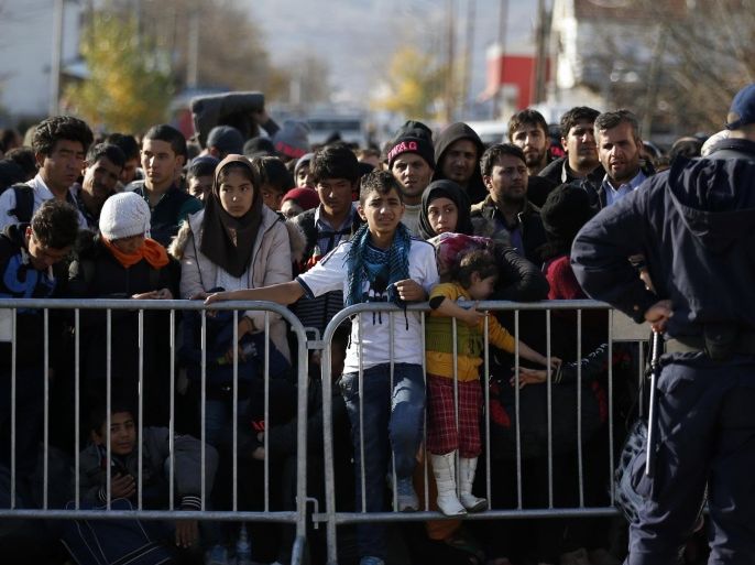 Migrants wait to register with the police at the refugee center in the southern Serbian town of Presevo, Monday, Nov. 16, 2015. Refugees fleeing war by the tens of thousands fear the Paris attacks could prompt Europe to close its doors, especially after police said a Syrian passport found next to one attacker’s body suggested its owner passed through Greece into the European Union and on through Macedonia and Serbia last month. (AP Photo/Darko Vojinovic)