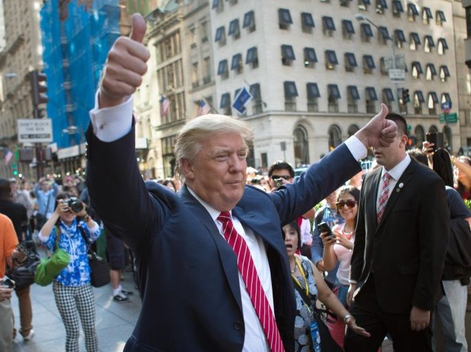 FILE - In this Sept. 24, 2015, file photo, Republican presidential candidate Donald Trump waves to the crowd gathered in front of Trump Tower ahead of the arrival of the pope's motorcade for an appearance in New York's Central Park. Trump holds a trademark to use the words “Central Park” on items including furniture, chandeliers and even key chains. Records show his first application came in 1991, when the city’s crime rate was near its height and the park had a less-than-glamorous reputation. (AP Photo/Kevin Hagen, File)