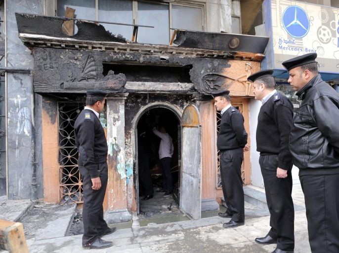 Members of the Egyptian security stand guard in the restaurant that was attacked near Cairo, Egypt, 04 December 2015. At least 12 people were killed in an overnight attack on a restaurant near Cairo, reports say that attackers threw petrol bombs at the restaurant in the plush quarter of Agouza, sparking a fire in the place. An unspecified number of people were also reported injured in the attack, the motives of which were not immediately clear. Egypt has seen a surge in militant attacks, mainly against security forces, since the military's 2013 overthrow of Islamist president Mohammed Morsi.