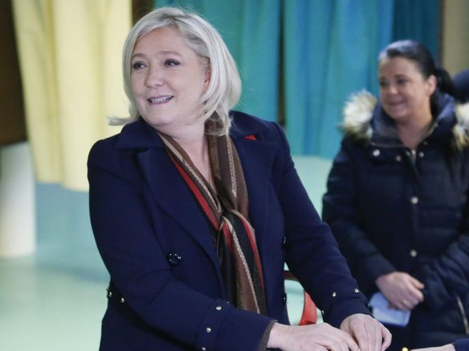 French far-right political party National Front (FN) Marine Le Pen casts her vote at a polling station during the first round of the regional elections in Henin-Beaumont, Northern France, 13 December 2015.