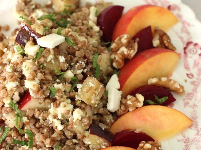 This July 13, 2015 photo shows kasha salad with beets, stone fruit, walnuts and mint in Concord, N.H. Kasha, the toasted form of buckwheat, cooks up in about 10 minutes. (AP Photo/Matthew Mead)