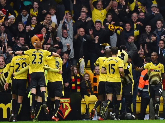 JR514 - Watford, Hertfordshire, UNITED KINGDOM : Watford's Nigerian striker Odion Ighalo (R) celebrates with teammates after scoring their third goal during the English Premier League football match between Watford and Liverpool at Vicarage Road Stadium in Watford, north of London on December 20, 2015. Watford won the game 3-0. AFP PHOTO / BEN STANSALL
