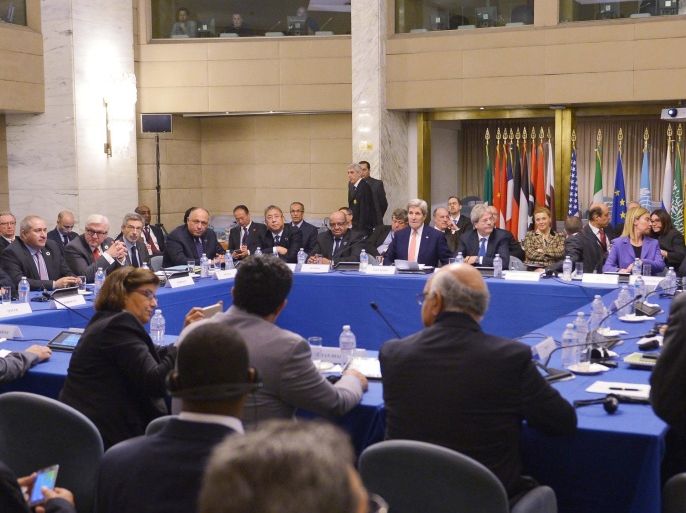 US Secretary of State John Kerry, background centre, takes part in an international conference on Libya at the Ministry of Foreign Affairs, in Rome, Sunday, Dec. 13, 2015. Diplomats from the United States, Europe and the Mideast met Sunday with leaders of Libya's rival political factions to impress upon them the need to adopt a U.N.-brokered national unity plan aimed at rescuing the country from chaos and preventing Islamic State extremists from gaining more ground. (Mandel Ngan/Pool Photo via AP)