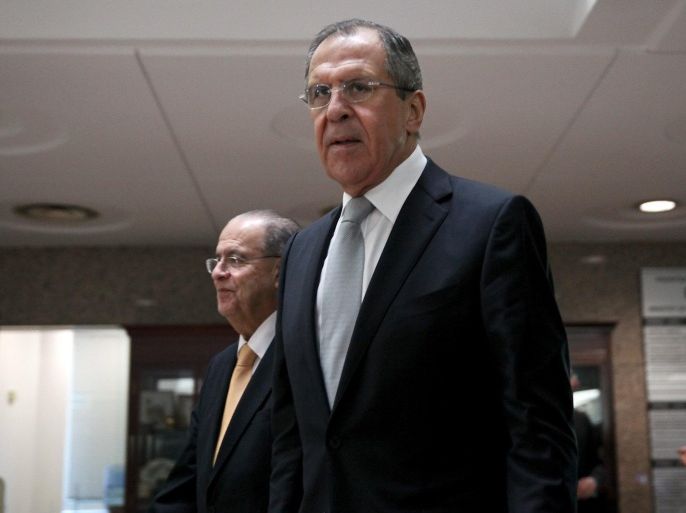 Russian Foreign Minister Sergei Lavrov (R) and Cypriot Foreign Minister Ioannis Kasoulides walk inside the Ministry of Foreign Affairs in Nicosia, Cyprus December 2, 2015. REUTERS/Yiannis Kourtoglou