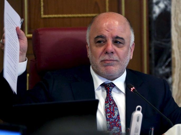 Iraq's Prime Minister Haider al-Abadi meet with Iraqi ministers in Baghdad August 9, 2015. Al-Abadi won the support of his cabinet on Sunday to eliminate a layer of senior government positions, part of a push to reduce corruption and save money in the face of mounting unrest. REUTERS/Iraqi PM Media Office/Handout ATTENTION EDITORS - THIS IMAGE WAS PROVIDED BY A THIRD PARTY. FOR EDITORIAL USE ONLY. NOT FOR SALE FOR MARKETING OR ADVERTISING CAMPAIGNS. NO ARCHIVES NO SALES.