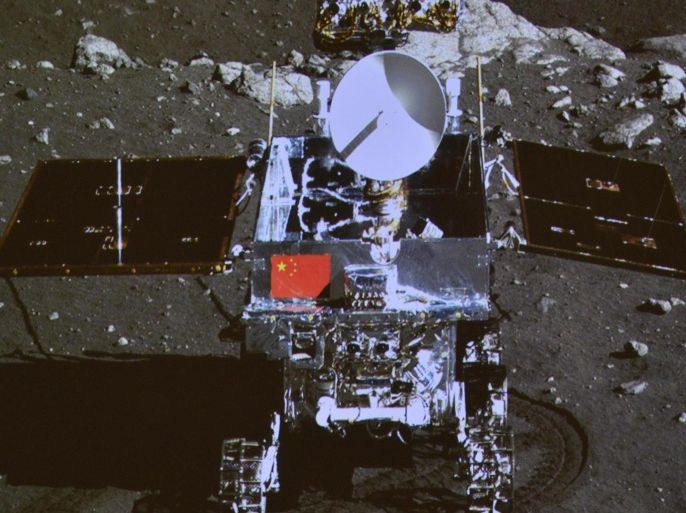 A photograph of the giant screen at the Beijing Aerospace Control Center shows photo of the Yutu, or "Jade Rabbit" lunar rover taken by the camera on the Chang'e 3 probe during the mutual-photograph process, in Beijing December 15, 2013. REUTERS/Stringer