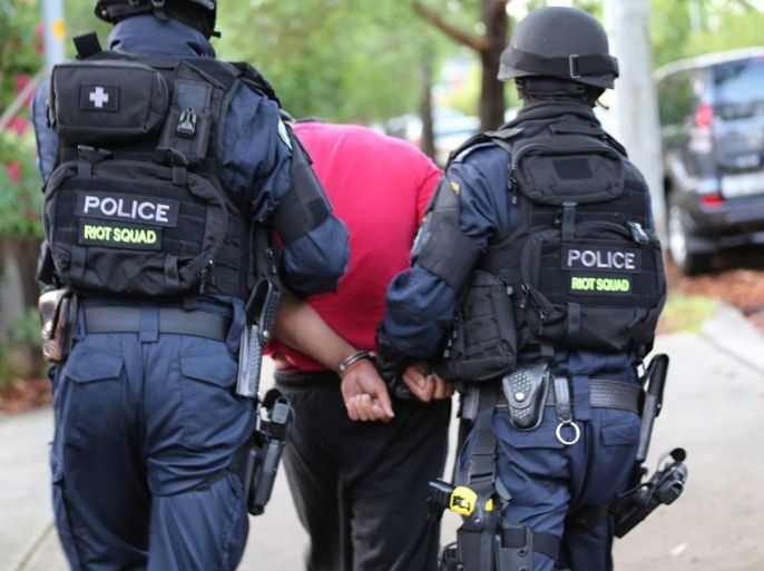 A handout picture made available by the New South Wales (NSW) Police shows a man being arrested by members of the Joint Counter Terrorism Team (JCTT) Sydney as part of the ongoing Operation Appleby investigation into the alleged planning of a terrorist attack, in Sydney, Australia, 23 December 2015. EPA/NSW POLICE