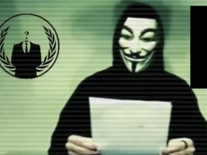 A man wearing a mask associated with Anonymous makes a statement in this still image from a video released on social media on November 16, 2015. Anonymous, the loose-knit network of activist hackers known for cyber attacks on government, corporate and religious websites, is preparing to unleash waves of cyberattacks on Islamic State following the attacks in Paris last week that killed 129 people, self-described members said in a video posted online. REUTERS/Social Media Website via Reuters TV ATTENTION EDITORS - THIS PICTURE WAS PROVIDED BY A THIRD PARTY. REUTERS IS UNABLE TO INDEPENDENTLY VERIFY THE AUTHENTICITY, CONTENT, LOCATION OR DATE OF THIS IMAGE. FOR EDITORIAL USE ONLY. NOT FOR SALE FOR MARKETING OR ADVERTISING CAMPAIGNS. NO RESALES. NO ARCHIVE. THIS PICTURE WAS PROCESSED BY REUTERS TO ENHANCE QUALITY. AN UNPROCESSED VERSION WILL BE PROVIDED SEPARATELY.
