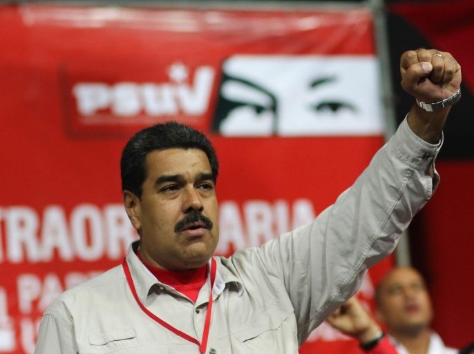 A handout picture released by the Miraflores Presidential Palace shows Venezuelan President Nicolas Maduro making fists as he attends the third Congress of the Socialist United Party of Venezuela (PSUV) in Caracas, Venezuela, 10 December 2015.