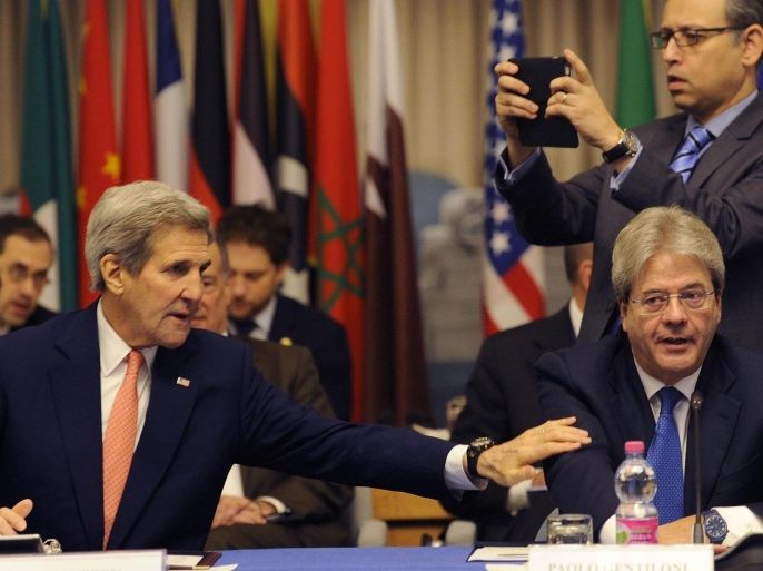 Italian Foreign minister Paolo Gentiloni (RIGHT) sits beside US Secretary of State John Kerry during the International Conference about Libya, in Rome, Italy, 13 December 2015.