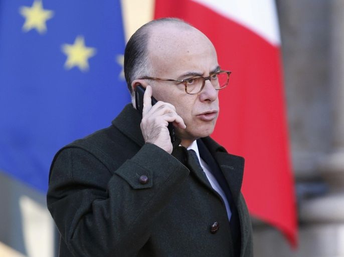 French Interior minister Bernard Cazeneuve speaks on his mobile phone following the weekly cabinet meeting at the Elysee Palace in Paris, France, December 9, 2015. REUTERS/Charles Platiau