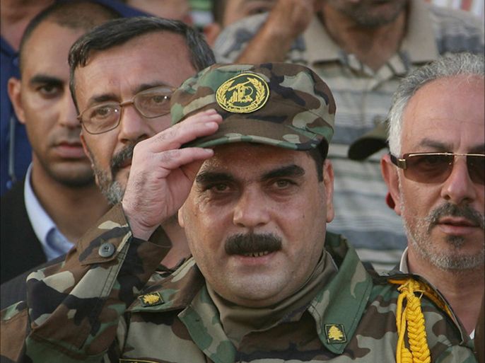epa01415748 Freed Lebanese prisoner Samir Kuntar salutes after his release at Naqura cross point between Lebanon and Israel border on 16 July 2007 flowing Hezbollah handed over the bodies of two Israeli soldiers seized by its guerrillas two years ago.