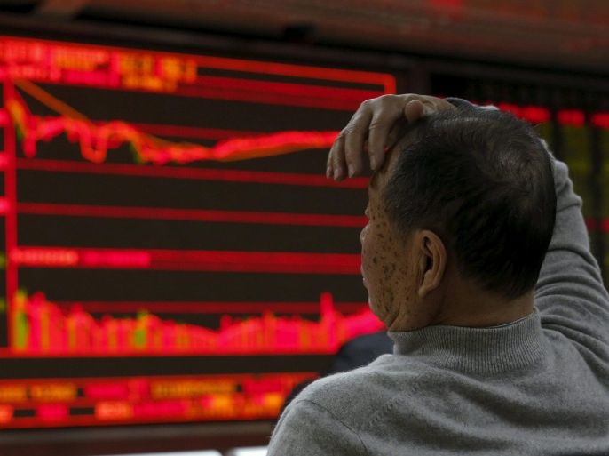 A man looks at an electronic board showing stock information at a brokerage house in Beijing, China, January 4, 2016. REUTERS/Kim Kyung-Hoon