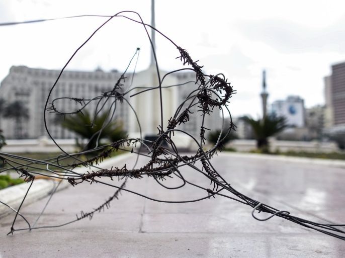 Barbed wire is seen a day ahead of the fifth anniversary of the Jan. 25, 2011 uprising in Tahrir Square, Cairo, Egypt, Sunday, Jan. 24, 2016. (AP Photo/Roger Anis)
