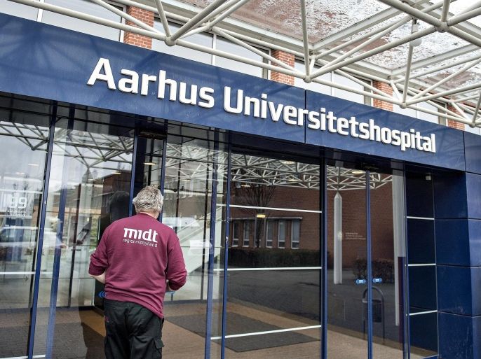 A man walks towards the entrance of the Aarhus University hospital is seen in Aarhus, Denmark, January 27, 2016. A Danish man who returned from a trip to Mexico and Brazil has tested positive for the mosquito-transmitted Zika virus, but is expected to recover soon, health officials said. The man in his mid-twenties suffered fever, headaches and muscle pain and was tested in the University Hospital in Denmark's second biggest city Aarhus on Tuesday, Professor Lars Ostergaard said. REUTERS/Henning Bagger/Scanpix 2016 ATTENTION EDITORS - THIS IMAGE WAS PROVIDED BY A THIRD PARTY. FOR EDITORIAL USE ONLY. NOT FOR SALE FOR MARKETING OR ADVERTISING CAMPAIGNS. THIS PICTURE IS DISTRIBUTED EXACTLY AS RECEIVED BY REUTERS, AS A SERVICE TO CLIENTS. DENMARK OUT. NO COMMERCIAL OR EDITORIAL SALES IN DENMARK. NO COMMERCIAL SALES.