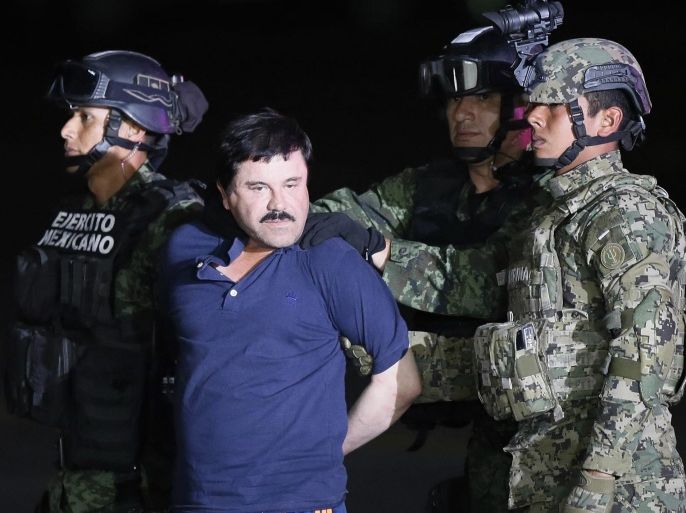 Alleged fugitive Mexican drug lord Joaquin 'El Chapo' Guzman is escorted by the authorities to a Mexican Army helicopter in Los Mochis, Sinaloa, Mexico, 08 January 2016, to be transferred to the prison from which he escaped on 11 July 2015. Guzman, allegedly one of the world's most powerful drug lords, made his second escape from a high-security prison in July 2015 using a series of sophisticated tunnels. The suspected head of the Sinaloa cartel was recaptured on 08 January in the town of Los Mochis near the Pacific Coast in his home state of Sinaloa, the Milenio newspaper reported citing Mexican security authorities.