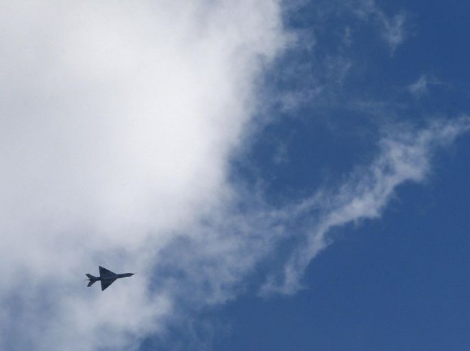 A warplane belonging to Libyan pro-government forces flies in the sky over sites occupied by the Shura Council of Libyan Revolutionaries, an alliance of former anti-Gaddafi rebels, who have joined forces with the Islamist group Ansar al-Sharia, in Benghazi, Libya December 27, 2015. REUTERS/Esam Omran Al-Fetori