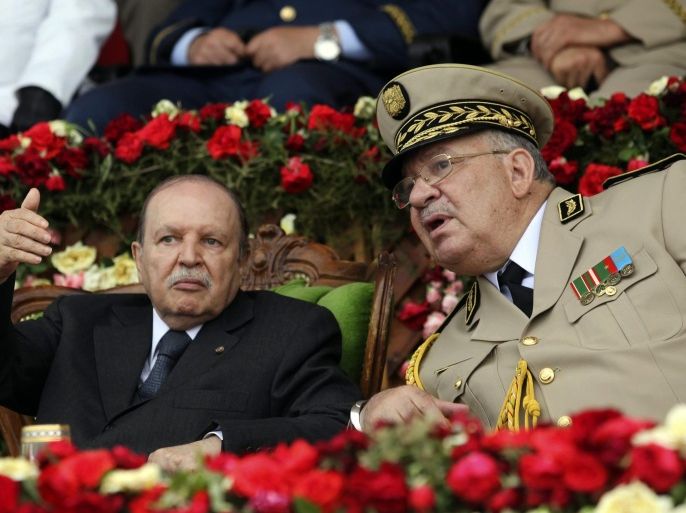 Algeria's President and head of the Armed Forces Abdelaziz Bouteflika (L) gestures while talking with Army Chief of Staff General Ahmed Gaid Salah during a graduation ceremony of the 40th class of the trainee army officers at a Military Academy in Cherchell 90 km west of Algiers June 27, 2012. REUTERS/Ramzi Boudina (ALGERIA - Tags: MILITARY POLITICS)