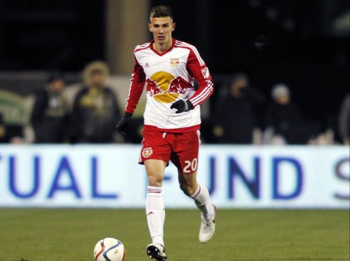 FILE - In this Sunday, Nov. 22, 2015 file photo, New York Red Bulls defender Matt Miazga carries the ball against the Columbus Crew during the first leg of the MLS soccer Eastern Conference championship in Columbus, Ohio. (AP Photo/Paul Vernon, File)