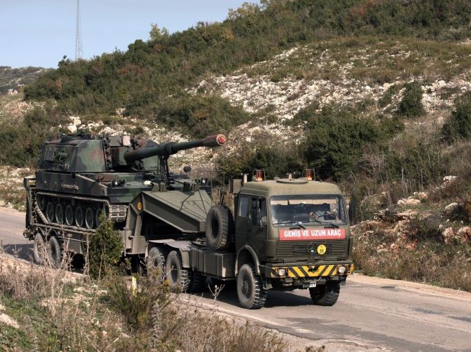 A Turkish army truck loaded with a self-propelled gun heading to the Syrian border near Yayladagi, Turkey, Wednesday, Nov. 25, 2015. Prime Minister Ahmet Davutoglu is seeking to reduce tensions with Moscow, saying that Russia is Turkey’s “friend and neighbor” and insisting relations cannot be “sacrificed to accidents of communication.” Davutoglu told his party’s lawmakers on Wednesday that Turkey didn’t know the nationality of the plane that was brought down at the border with Syria on Tuesday until Moscow announced it was Russian.(AP Photo)