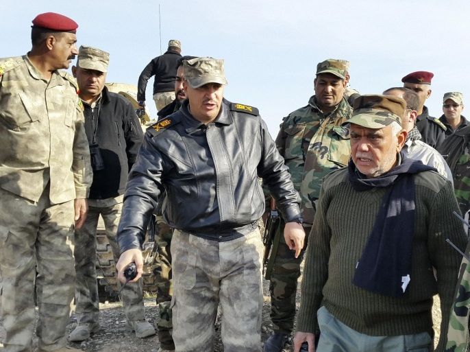 Head of the Badr Organisation Hadi al-Amiri (R) speaks with officers on the outskirts of Muqdadiyah in Diyala province, north of Baghdad in this January 23, 2015 file photo. To match Special Report MIDEAST-CRISIS/COMMITTEE REUTERS/Stringer/Files (IRAQ - Tags: MILITARY POLITICS CIVIL UNREST)
