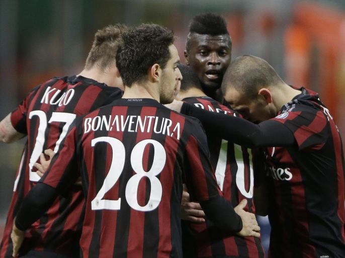 AC Milan's Mbaye Niang, second from right, celebrates with teammates after scoring during the Italian Cup soccer match between AC Milan and Carpi at the San Siro stadium in Milan, Italy, Wednesday, Jan. 13, 2016. (AP Photo/Antonio Calanni)