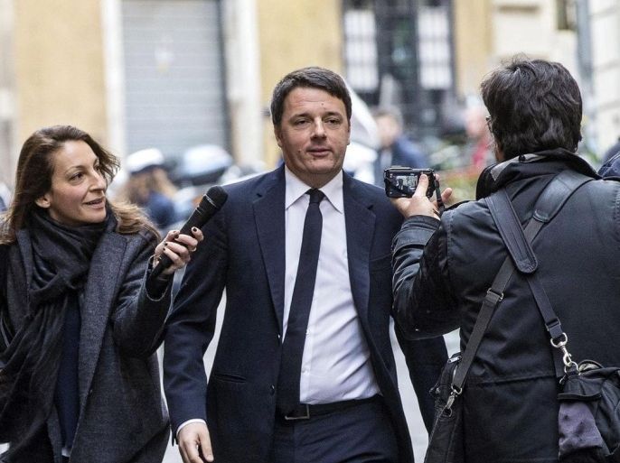 Italian Premier Matteo Renzi (C) arrives at the headquarters of the Foreign Press club to hold a press conference on the second anniversary of him becoming premier, Rome, Italy, 22 February 2016. Renzi was elected into office on 22 February 2014.