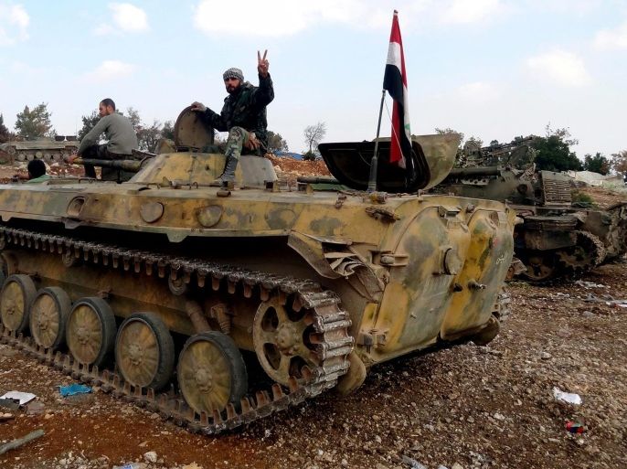 A handout picture made available on 28 November 2015 by the official Syrian Arab News Agency (SANA) and described as showing Syrian army soldiers on their tanks in the al-Rahmalia and al-Khidr hills in the northern countryside of Latakia, Syria, 27 November 2015. According to SANA reports, Syrian Army units, in cooperation with popular defense groups, established control over the al-Rahmalia and al-Khidr hills in the northern countryside of Lattakia after heavy clashes. The source added that army units eliminated the latest terrorist sites in the two hills and members of engineering units dismantled the explosive devices which were planted in the area.  EPA/SANA / HANDOUT