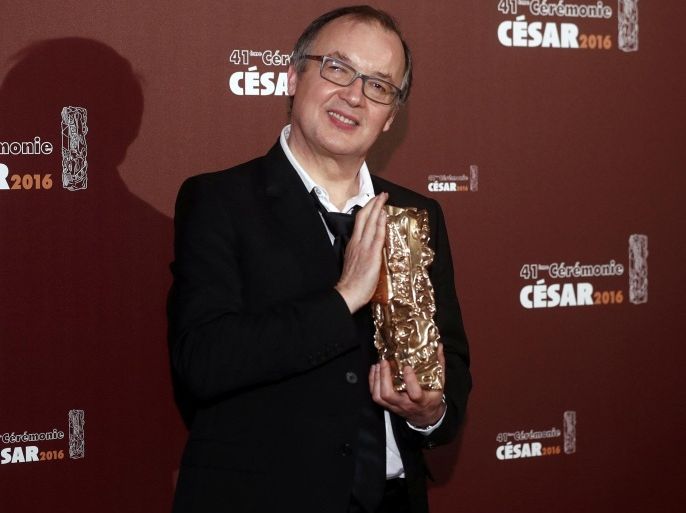 Director Philippe Faucon holds his trophy during a photocall after receiving the Best Film Award for his film "Fatima" at the 41st Cesar Awards ceremony in Paris, France, February 26, 2016. REUTERS/Christian Hartmann