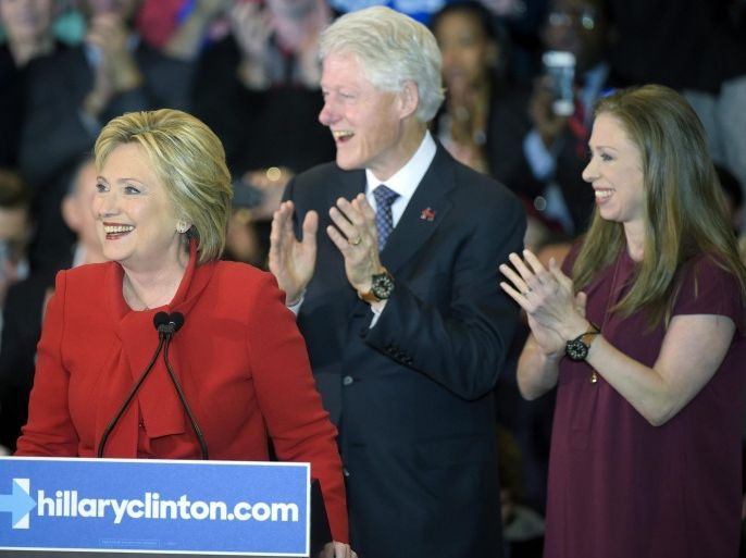 US Democratic presidential candidate Hillary Clinton (L) reacts while speaking as her husband former US President Bill Clinton (C) and her daughter Chelsea Clinton (R) look on, during the Democratic Caucuses night campaign rally at Olmsted Center, Drake University in Des Moines, Iowa, USA, 01 February 2016. The Iowa Caucus is the first official test of candidates seeing their parties' nominations.