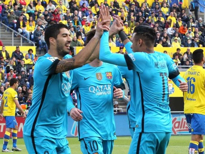 Barcelona's forward Uruguayam Luis Suarez (L) celebrates a goal with his teammate Neymar Jr (R) during their Primera Division Liga match against UD Las Palmas held at the Gran Canaria stadium in Las Palmas at the Canary Islands in Spain on 20 February 2016.