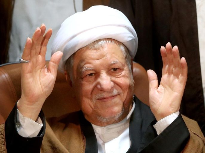Former Iranian President Akbar Hashemi Rafsanjani, who is also a member of the Experts Assembly, waves to media as he registers his candidacy for the Feb. 26 elections of the assembly at interior ministry in Tehran, Iran, Monday, Dec. 21, 2015. (AP Photo/Ebrahim Noroozi)