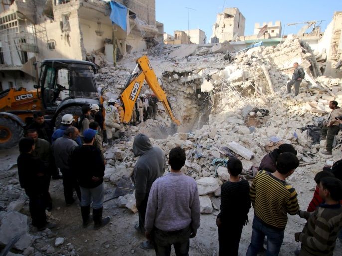 Civil defence members search for survivors after airstrikes by pro-Syrian government forces in the rebel held al-Qaterji neighbourhood of Aleppo, Syria February 14, 2016. REUTERS/Abdalrhman Ismail