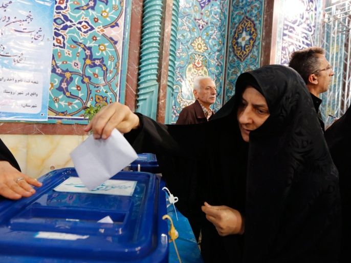 An Iranian woman casts her vote in the parliamentary and Experts Assembly election at a polling station at Ershad Mosque in Tehran, Iran, 26 February 2016. Nearly 55 million voters will elect on 26 February the representatives out of 6,229 candidates competing for 290 parliamentary seats, in addition to choosing 88 members out of 161 clerics for the Assembly of Experts, the body responsible for electing a new supreme leader in case the post becomes vacant.