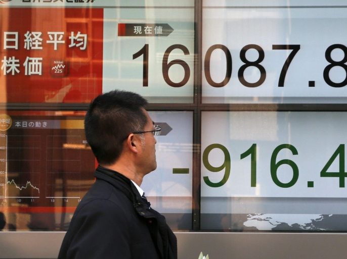 A businessman looks at the figure of Tokyo's Nikkei Stock Average at the start of the afternoon trade session in Tokyo, Japan, 09 February 2016. Tokyo stocks dived sharply after US and European markets sank on some concerns about global economic outlook. Tokyo's 225-issue Nikkei Stock Average was down 918.86 points, or 5.40 per cents, to close at 16,085.44.