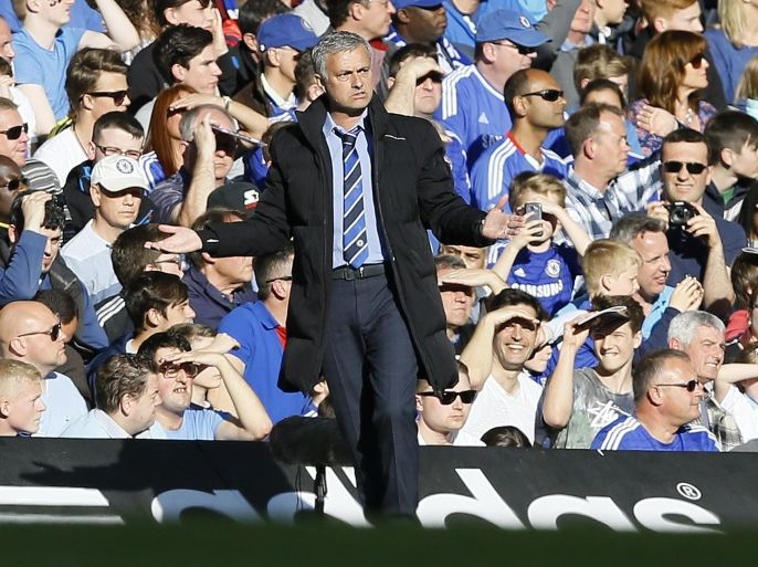 Chelsea's manager Jose Mourinho holds out his arms during the English Premier League soccer match between Chelsea and Manchester United at Stamford Bridge stadium in London, Saturday, April 18, 2015. (AP Photo/Kirsty Wigglesworth)