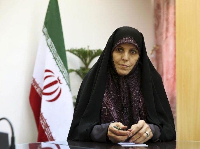 Vice President for Women and Family Affairs Shahindokht Molaverdi listens to a question during an interview with The Associated Press at her office in Tehran, Iran, Monday, June 8, 2015. Molaverdi said a limited number of women will be allowed to watch Volleyball World League games in Tehran later this month as it lifts a ban on Iranian women attending male sporting events. (AP Photo/Ebrahim Noroozi)
