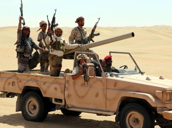 A photograph made available on 23 February 2016 shows pro-Yemeni government fighters riding a truck during a gathering in a desert area reportedly ahead of an offensive against al-Qaeda-held southern towns, in the eastern province of Shabwa, Yemen, 22 February 2016. According to reports, Al-Qaeda in the Arabian Peninsula (AQAP) has seized control of a coastal town in Yemen's southern Abyan province two days ago, the latest in a series of recent advances in the region that have enabled AQAP to consolidate its grip over much of Yemen's Gulf of Aden coastline.