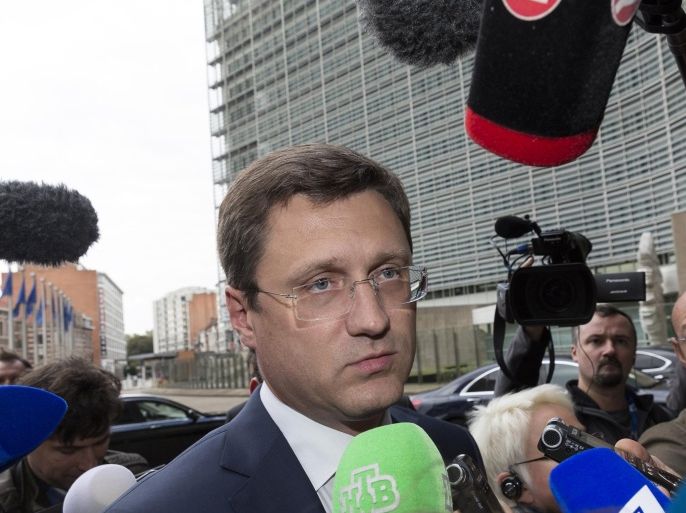 Russia's Energy Minister Alexander Novak, center, speaks with the media as he arrives in front of EU headquarters in Brussels on Friday, Sept. 25, 2015. Russia and Ukraine resumed talks on Friday in Brussels, aimed at trying to clinch a deal guaranteeing that Ukraine will receive shipments of Russian natural gas this winter. (AP Photo/Thierry Monasse)