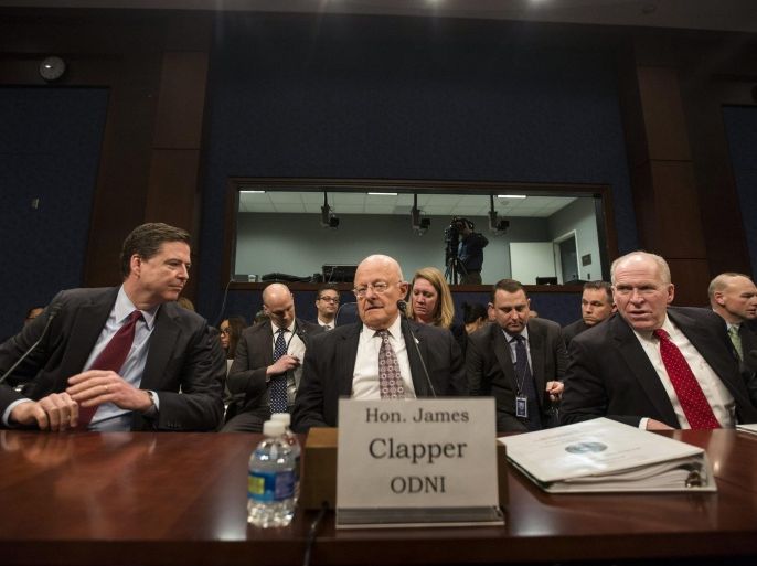Director of National Intelligence James Clapper (C); FBI Director James Comey (L); and CIA Director John Brennan (R) prepare to testify before the House Select Intelligence Committee on 'World Wide Threats' in the U.S. Capitol in Washington, DC, USA, 25 February 2016. The were joined by leaders from the NSA and the Defense Intelligence Agency.