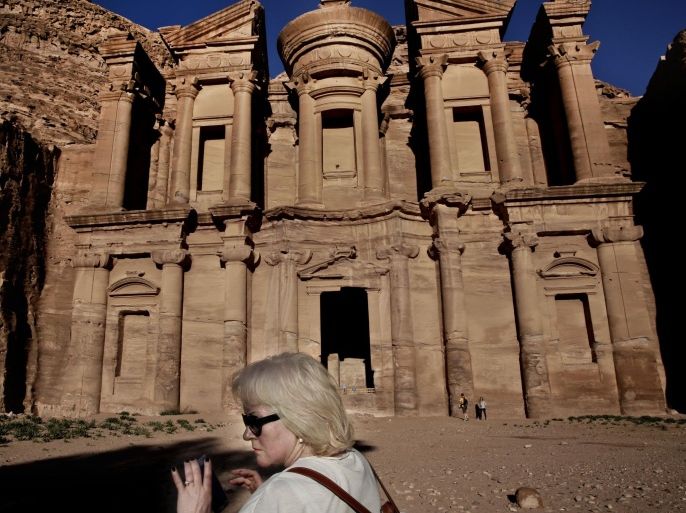 A tourist visits the Monastery in the ancient city of Petra, Jordan, Wednesday, Jan. 13, 2016. (AP Photo/Nariman El-Mofty)
