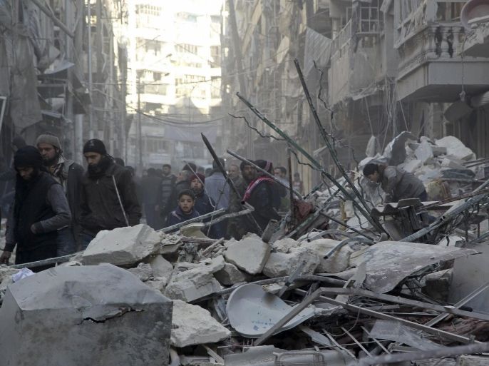 Residents inspect damage after airstrikes by pro-Syrian government forces in the rebel held Al-Shaar neighborhood of Aleppo, Syria February 4, 2016. REUTERS/Abdalrhman Ismail