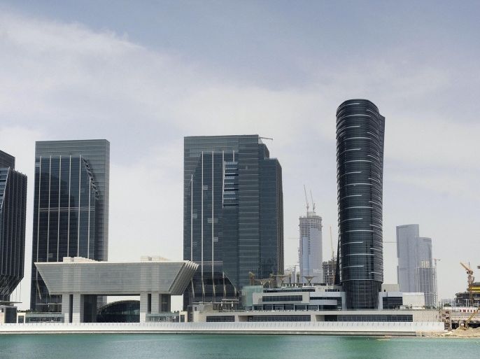 Buildings are seen at Sowwah Square on Marayah Island in Abu Dhabi's new central business district May 7, 2013. Last week Abu Dhabi outlined plans for a full-service financial zone on the island near Abu Dhabi's downtown area; the zone will have its own administration, court system and tax incentives to lure banks and other firms from around the world. The announcement caused consternation among thousands of bankers, fund managers and other finance professionals in Dubai, some of whom may in future have to commute along the 130-kilometre (80-mile) highway linking the desert cities - or even move permanently to Abu Dhabi. Picture taken May 7, 2013. REUTERS/Ben Job (UNITED ARAB EMIRATES - Tags: BUSINESS POLITICS)