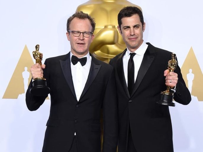 Tom McCarthy, left, and Josh Singer pose with the award for best original screenplay for “Spotlight” in the press room at the Oscars on Sunday, Feb. 28, 2016, at the Dolby Theatre in Los Angeles. (Photo by Jordan Strauss/Invision/AP)