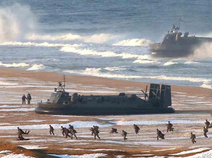 (FILE) A file photo released in March 2013, by North Korea's official Korean Central News Agency (KCNA), shows North Korean army and navy soldiers conducting a joint drill with amphibious landing crafts on an unidentified North Korean beach. About ten North Korean air-cushioned landing crafts have left their home base in Cholsan, North Pyongan Province, and come forward to the Goampo naval base, located about 60 kilometers north of the Northern Limit Line in the Yellow Sea, the de facto inter-Korean sea border, South Korean military sources said on 24 August 2015. EPA/KCNA SOUTH KOREA OUT